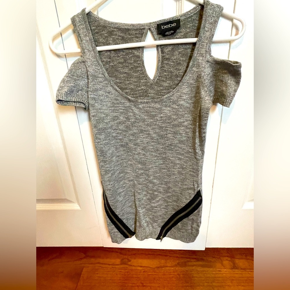 Bebe Xs short sleeve, cut-off shoulder silver shimmer sweater with zipper detail